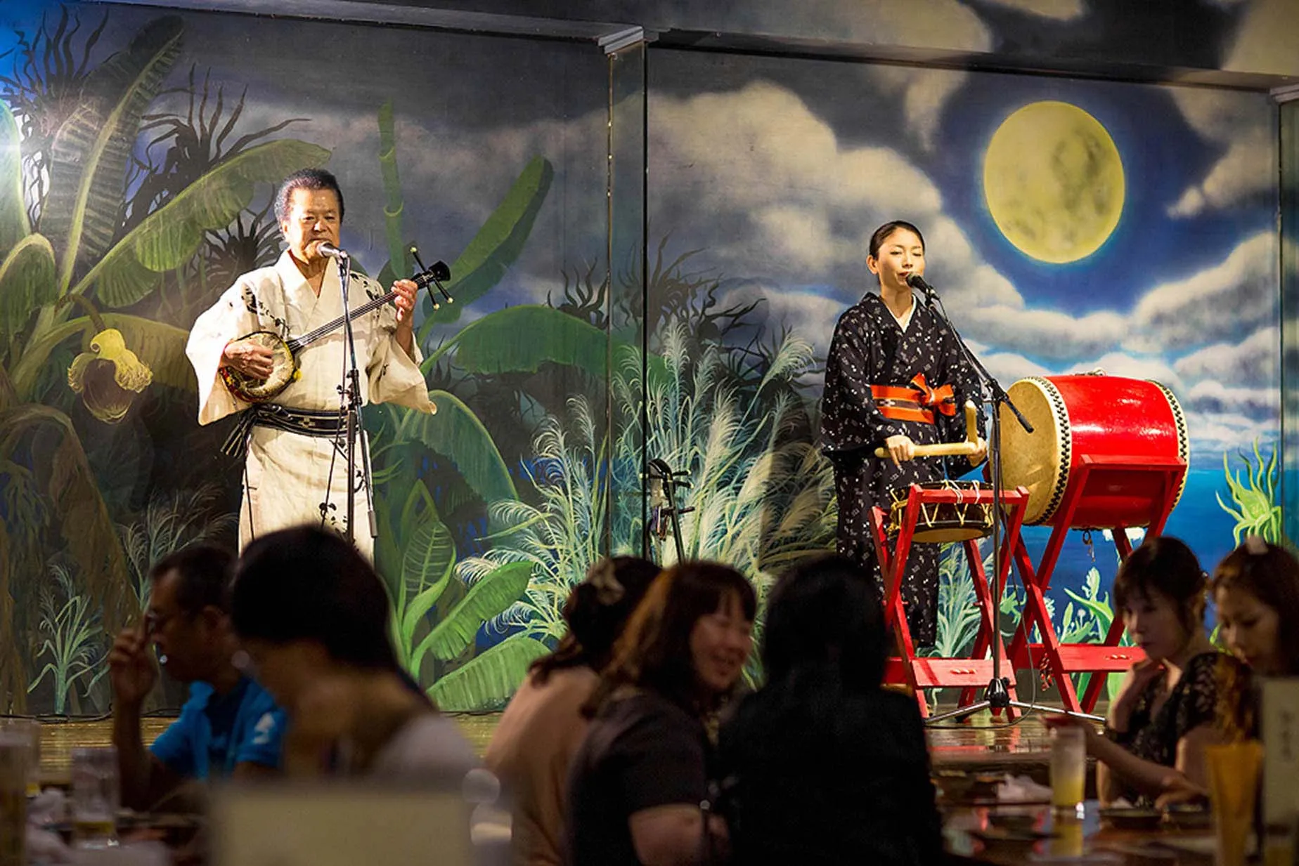 performers playing traditional okinawan instruments