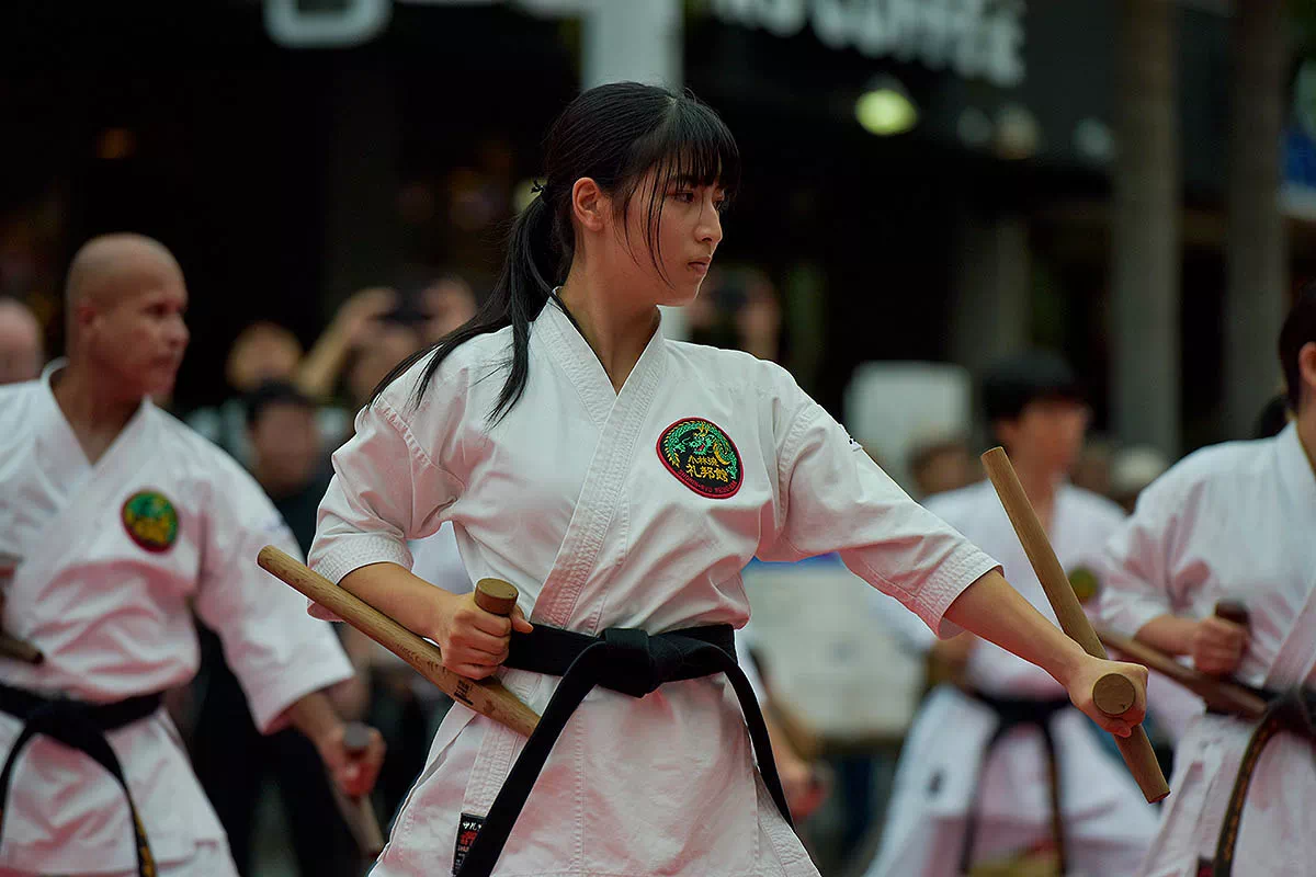 performers with tonfa batons